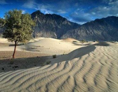 Nestled amidst the towering peaks of the Karakoram Range in Pakistan lies a mesmerizing and unexpected sight: the Katpana Desert.